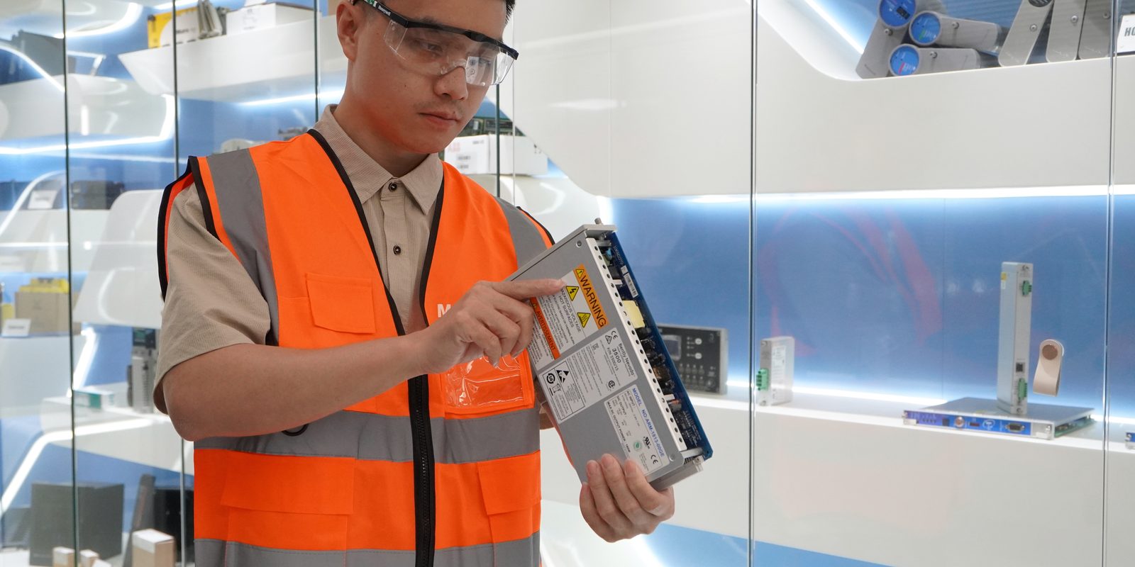 PLC Autocontroller engineer inspecting an industrial automation module