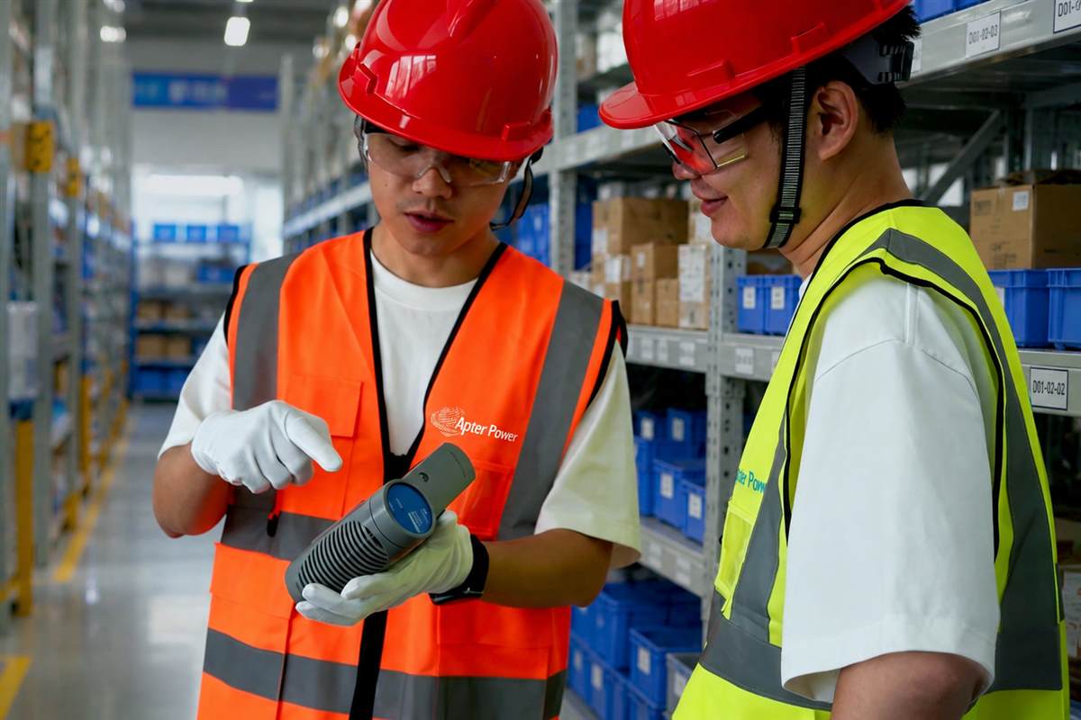 Warehouse technicians inspecting industrial automation equipment before dispatch